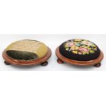 A pair of Victorian embroidered footstools raised on bun feet. 37cm diameter. (2)