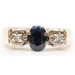 A 9ct gold sapphire and diamond three stone ring, M, 3.2gm