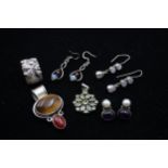 Two silver and gemset pendants, three pairs of ear rings and a ring, 63gm