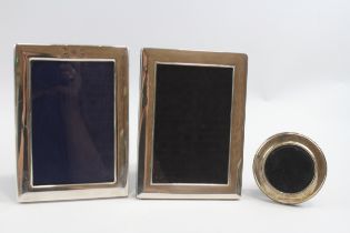 A silver photograph frame, 18.5 x 13cm, Sheffield 2005 and two other silver frames.
