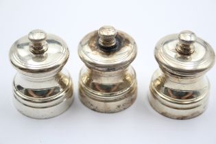 A set of three salt and pepper grinders, London 1987/8, two P, one S, 5cm high