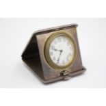 A silver cased travelling 8 day bedside clock, London 1920, with engine turned decoration, 9.5 x 9.