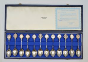 A silver set of 12 Zodiac limited edition tea spoons, by David Cornell for John Pinches, London