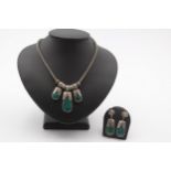 A silver and turquoise matrix type of stone necklace and ear rings, 56gm