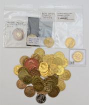 A collection of 23 half guinea gaming tokens, In Memory of the Good Old Days, 1788, and 27 other