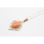 A 9ct gold and coral openwork pendant, 40mm overall, chain, 4.2gm