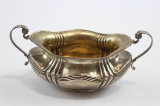 A silver two handled sugar bowl, Sheffield 1908, 15.5cm across the handles, 107gm