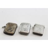Three silver vesta cases, Birmingham 1894,1928 and Chester 1900, 49gm