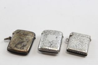 Three silver vesta cases, Birmingham 1894,1928 and Chester 1900, 49gm