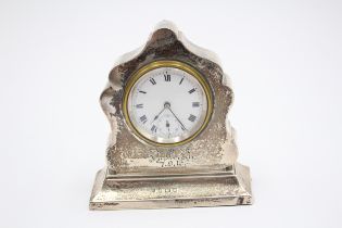 A silver desk timepiece, Birmingham 1916, initialled and dated, 9.5cm.