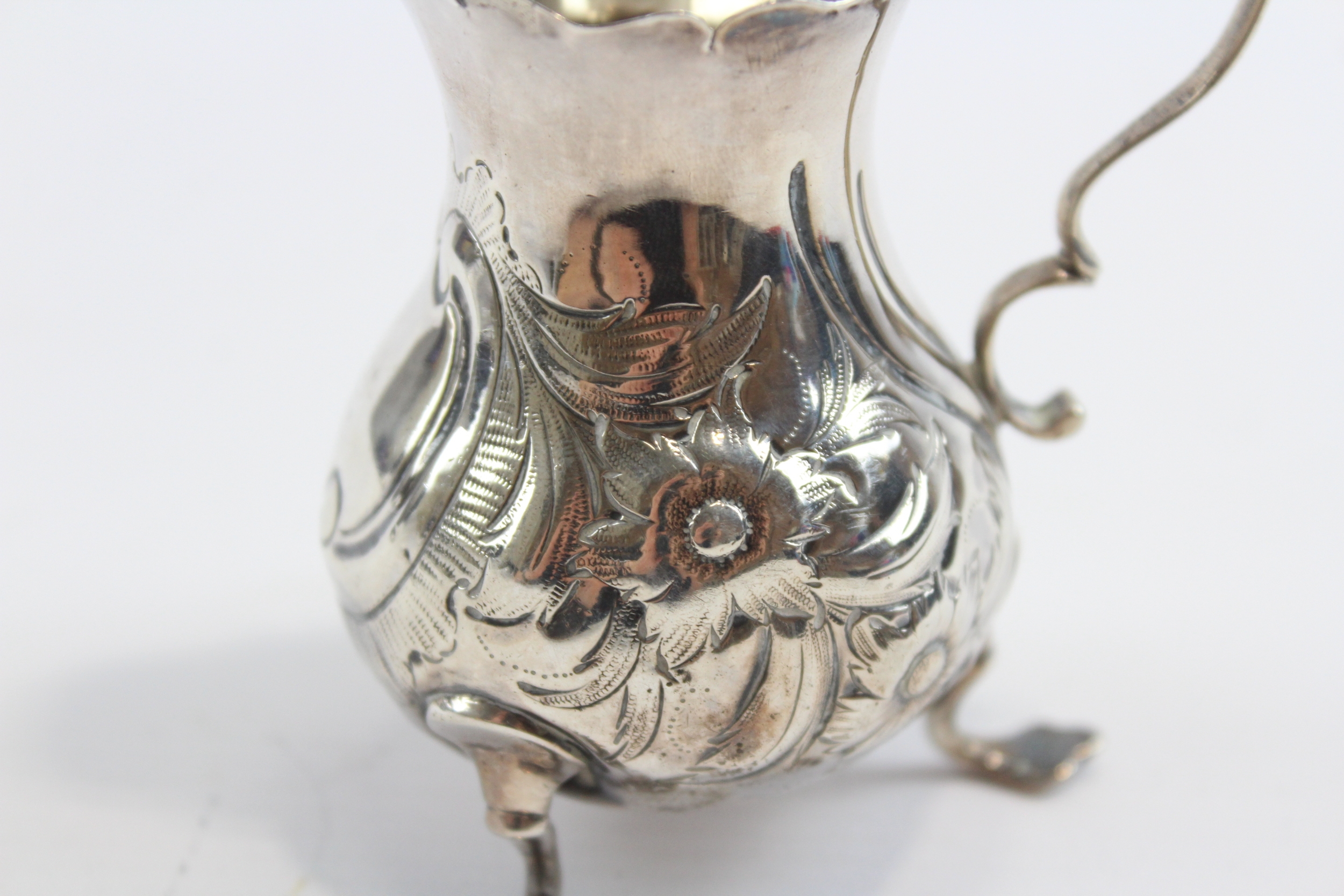 A George III silver embossed cream jug, London 1763, 9.5cm, 69gm - Image 4 of 6