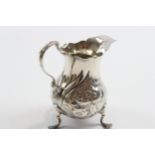 A George III silver embossed cream jug, London 1763, 9.5cm, 69gm