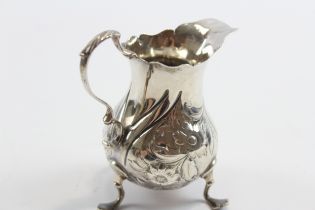 A George III silver embossed cream jug, London 1763, 9.5cm, 69gm
