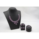 A silver, amethyst and ruby suite of necklace, ear pendants and ring, 57gm