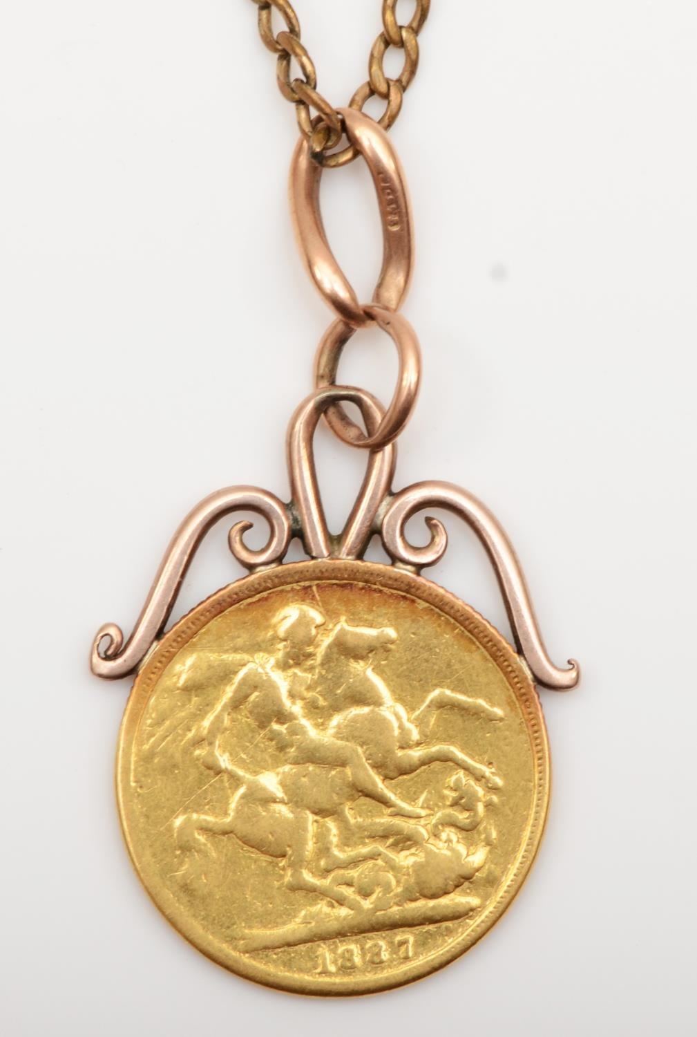 A Victorian Old Head 1887 sovereign, hard soldered as a pendant, metal chain, pendant 9.2gm - Image 2 of 3