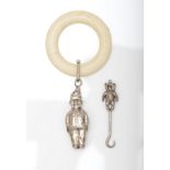 A silver rattle, Chester 1948, in the form of a clown, 11cm and a teddy bear button hook, Birmingham