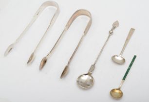 A George III silver fiddle pattern pair of sugar tongs, London 1818, another pair 1831, a mustard