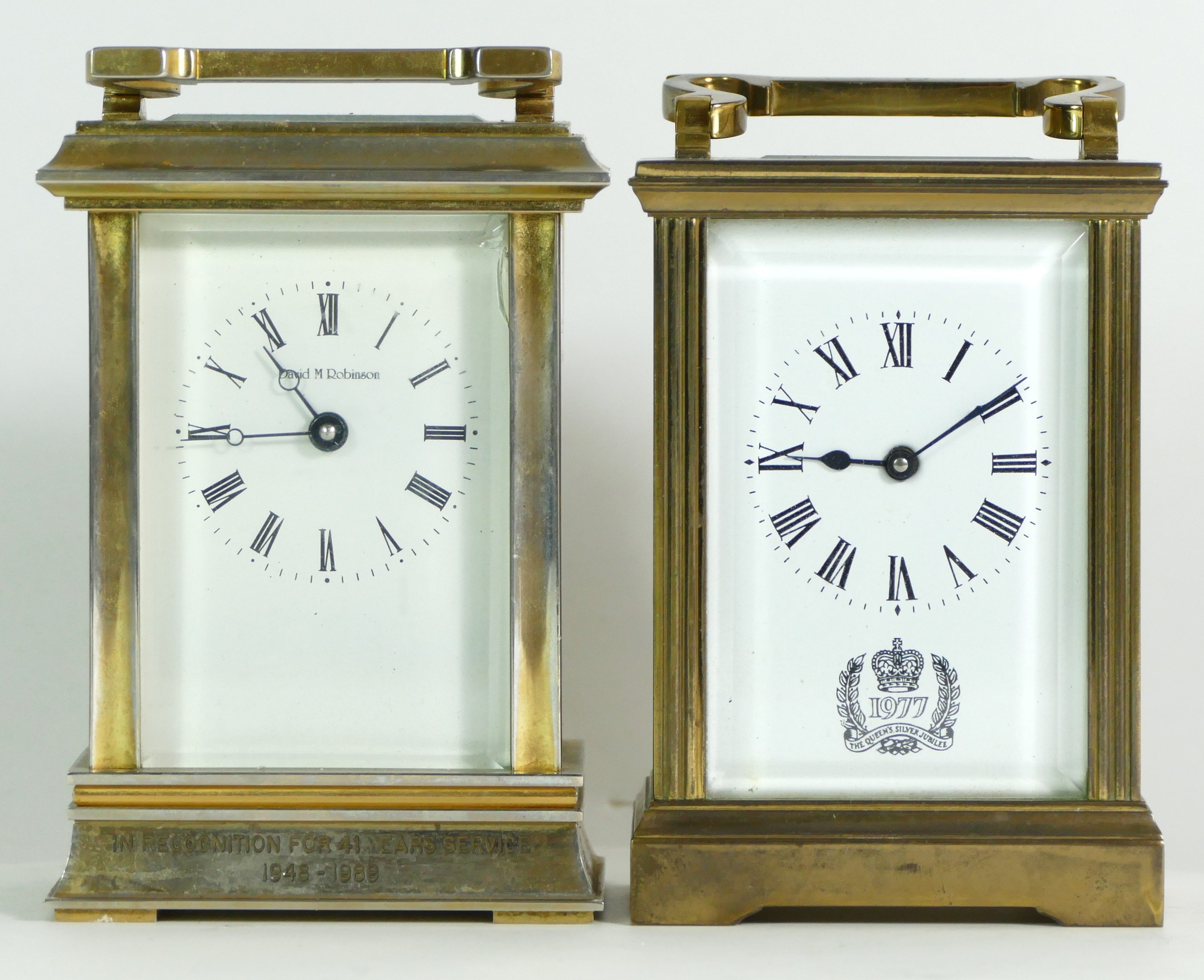 A 1970s brass 8 day carriage clock, commemorating the Queens' Silver Jubilee, together with a