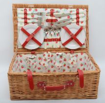 A modern wicker picnic basket with fitted interior.