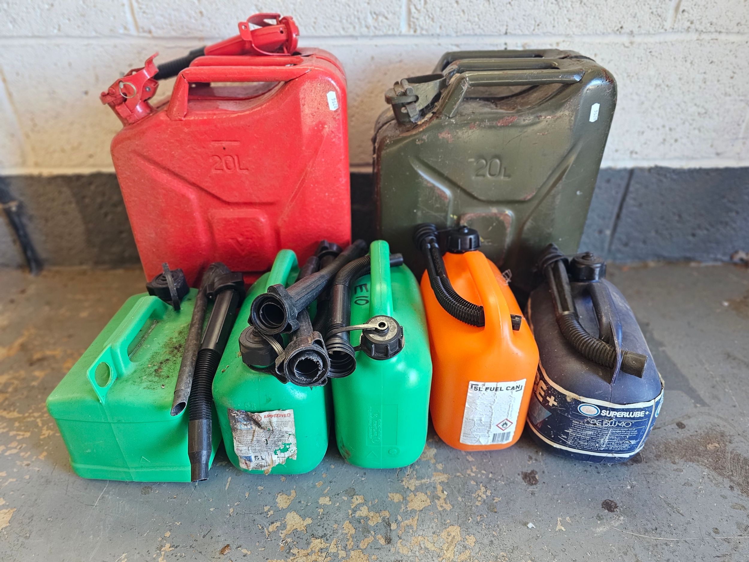 Two 20lt Jerry cans, and five plastic 1 gallon cans