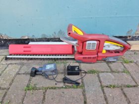 A Wolf Garten cordless Li-Ion hedge cutter, model HSA 45, with charger and two batteries