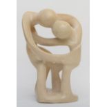 A soapstone sculpture, depicting the symbol of family, 34cm tall.