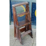 An early 20th century pitch pine metamorphose chair/ladder, seat height 18cm, ladder height 36cm.