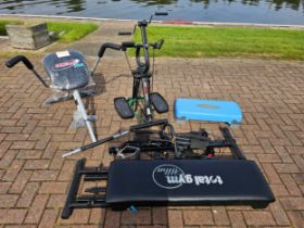 A Total Gym Ultra machine, an Instant Abs machine, a Mini Mobility Trainer and a step