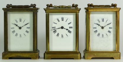 Three mid 20th century 8 day brass carriage clocks, unnamed. (3)