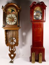 A mid 20th century Dutch wall clock, having moonphase with twin weight movement striking on bell,