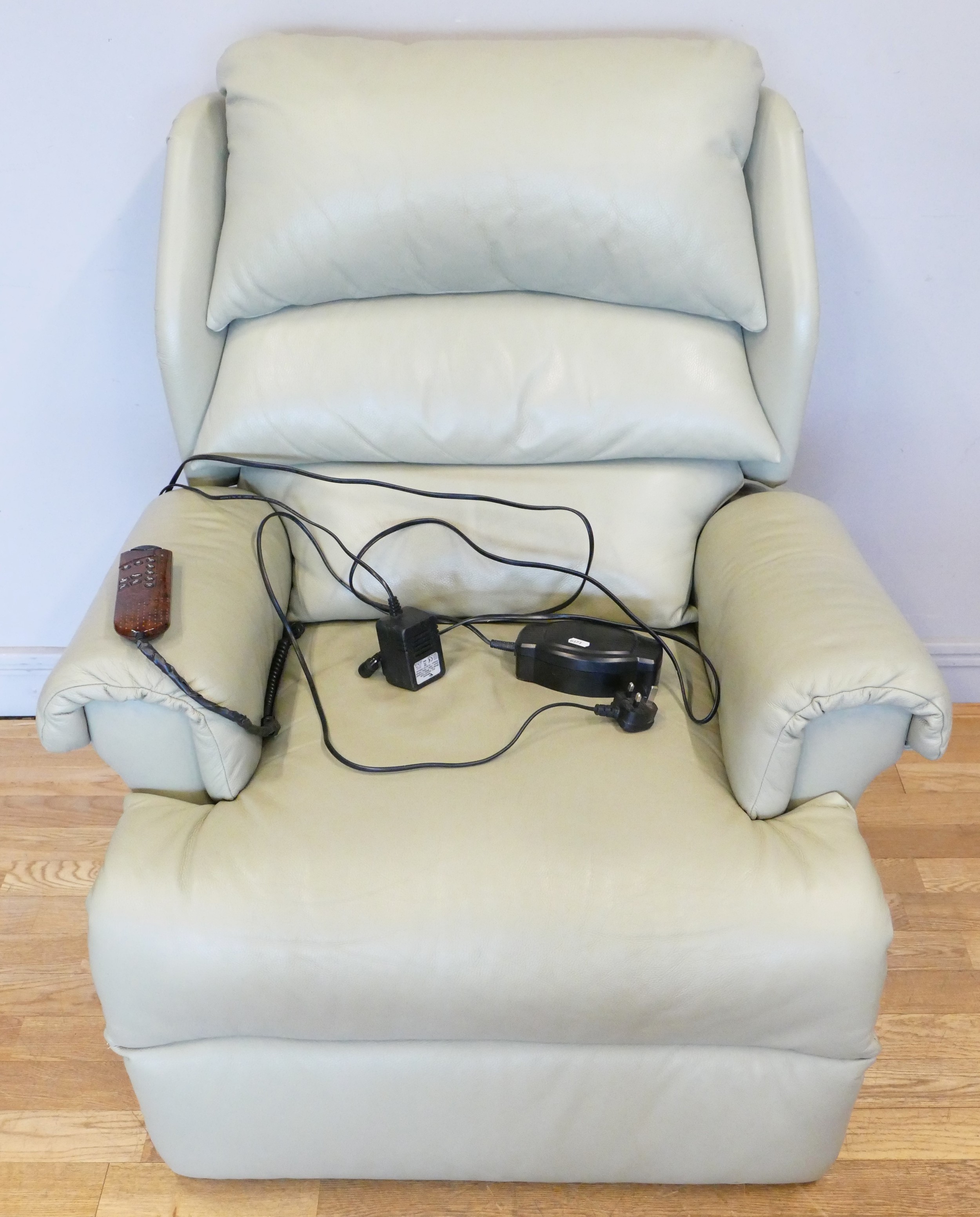 A modern electric recliner/riser and massager by Willow Brook, upholstered in a teal colour leather,