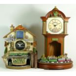 Bradford Editions; two Flying Scotsman novelty clocks, having battery operated automated