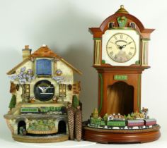 Bradford Editions; two Flying Scotsman novelty clocks, having battery operated automated