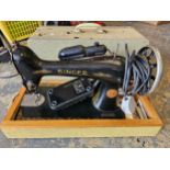 A Singer electric sewing machine, model number Y2664474, carry case