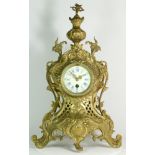 A 20th century French gilt brass Rococo style mantel clock, with an eight day movement. 50cm tall.