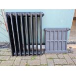 An Ideal cast iron 8 division radiator, 56 x 72cm, and another smaller radiator, no brackets.