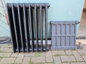 An Ideal cast iron 8 division radiator, 56 x 72cm, and another smaller radiator, no brackets.