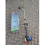 A Spear & Jackson 31cc 43cm 4 stroke petrol grass strimmer.