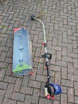 A Spear & Jackson 31cc 43cm 4 stroke petrol grass strimmer.