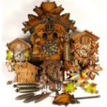 A collection of mid 20th century and later mantel clocks, together with a selection of cuckoo clocks