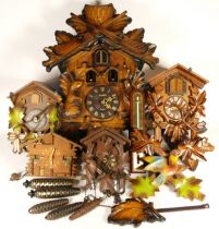 A collection of mid 20th century and later mantel clocks, together with a selection of cuckoo clocks