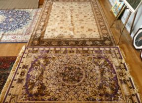 Two Belgium rugs, comprising of a man made silk example, purple with floral borders, 198x300cm,