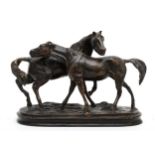 A bronze model of two horses, after Pierre Jules Mene, on naturalistic oval base. 21cm tall.