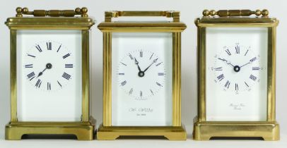 An English brass 8 day carriage clock, together with two unnamed examples. (3)