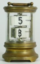 An early 20th century brass ticket clock. 13.5cm tall.