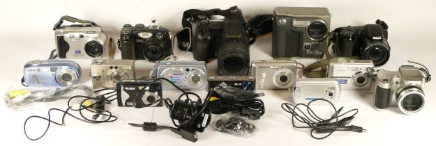 A collection of early digital cameras, to include a Sony Mavica, a Nikon Coolpix 5400, a Sony