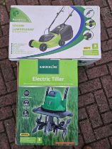 A Garden Line electric tiller and a 1000W electric lawnmower, both unused and unopened.