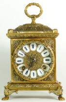 A German made brass bracket clock, having an 8 day movement striking on bell. 23cm tall.