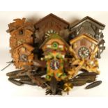 A collection of cuckoo clocks and clock parts, for spares or repair.