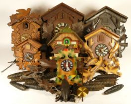 A collection of cuckoo clocks and clock parts, for spares or repair.